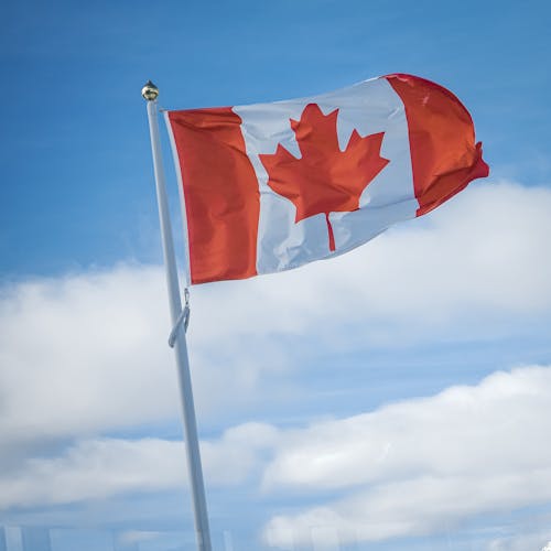 Canadian Flag with Cloud in Background