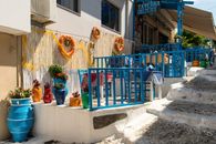 Picturesque Greek taverna in Kos, showcasing colorful decor and traditional Mediterranean architecture.