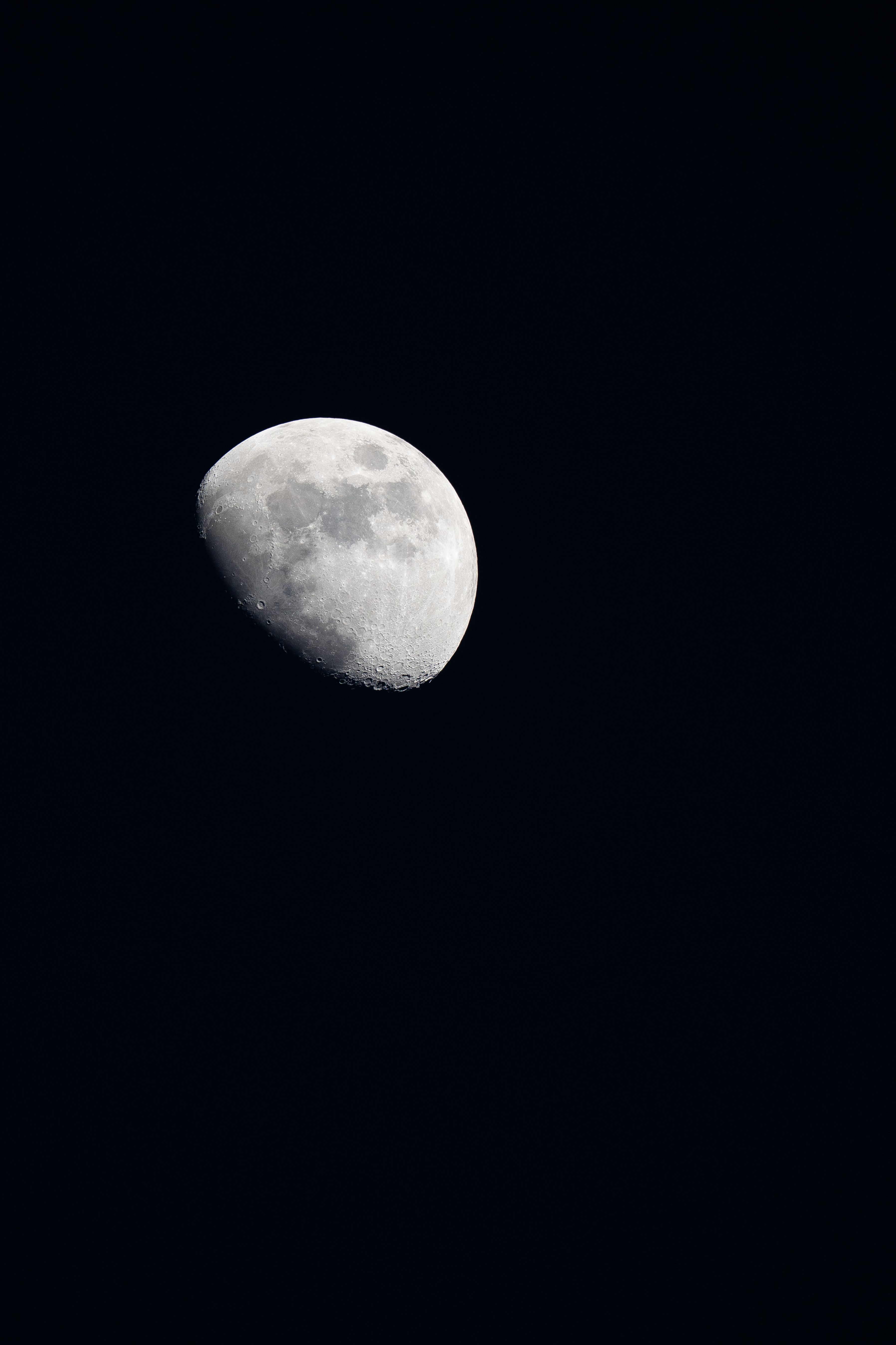Detailed image of the moon against a dark night sky, captured over Les Belleville, France.