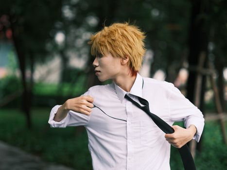 Cosplay enthusiast in an action pose outdoors in Vietnam. Captured vibrancy and energy.