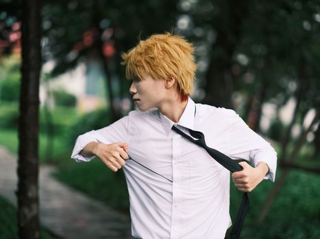 Dynamic cosplay portrait of an adult in a white shirt outdoors in Vietnam.