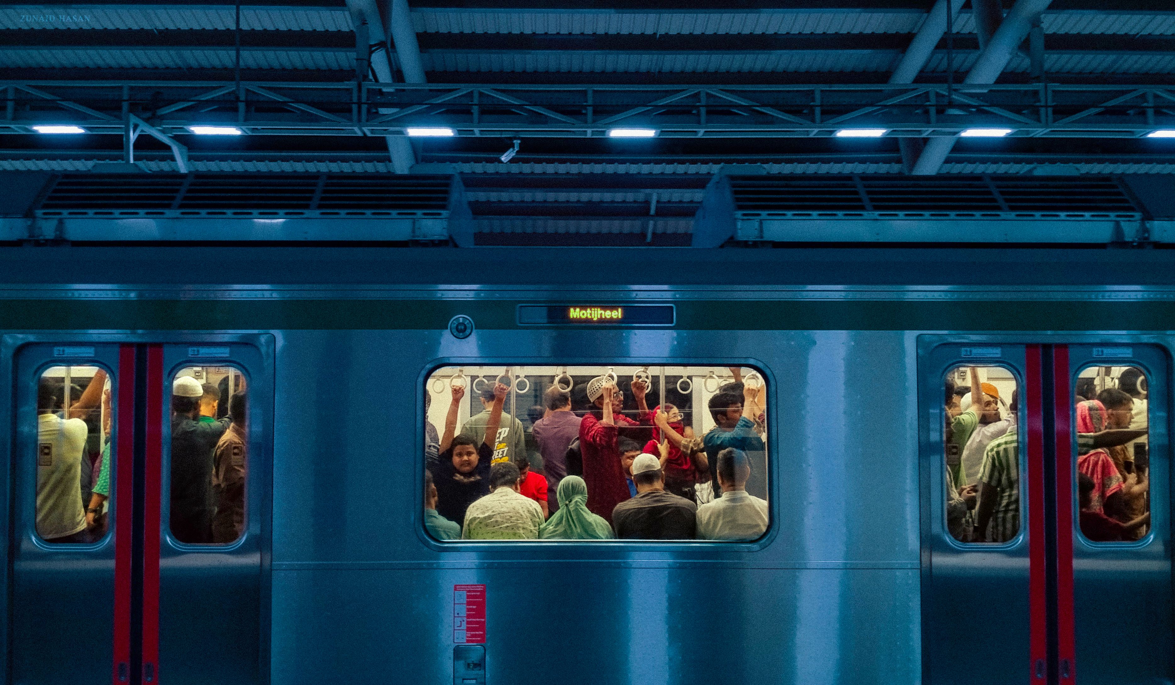A packed metro train in Dhaka, Bangladesh, during the evening. Commuters inside the train heading to Motijheel.