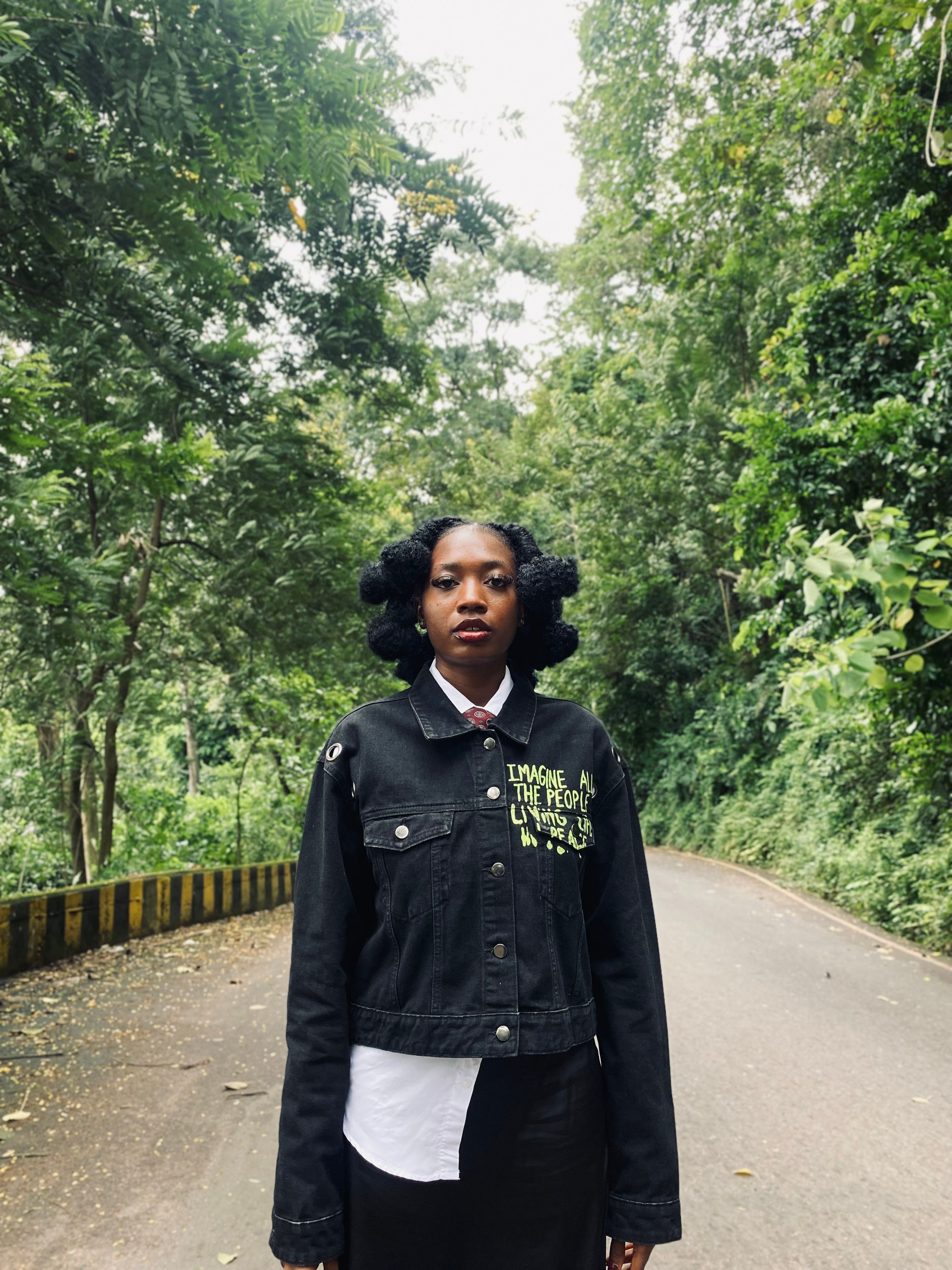 Woman in black jacket standing on forest road · Free Stock Photo