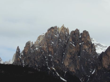 Stunning view of the snow-dusted peaks of the Dolomites in Trentino-Alto Adige, Italy.