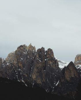Breathtaking view of the rugged snow-capped peaks in the Dolomites, perfect for adventure and nature lovers.