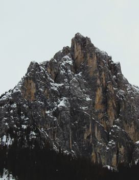 Stunning view of snow-covered rocky peaks in Trentino-Alto Adige, Italy.