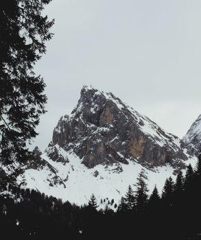 Breathtaking view of snow-covered mountains in a tranquil alpine setting. 37455404