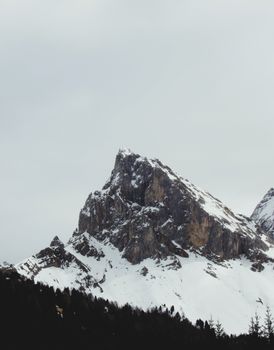 Majestic snowy mountain peak in Trentino-Alto Adige, Italy with a cloudy sky. 37455410