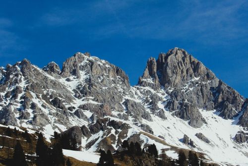 Free Stunning view of snowy Dolomite mountains under a clear blue sky in Trentino-Alto Adige, Italy. Stock Photo