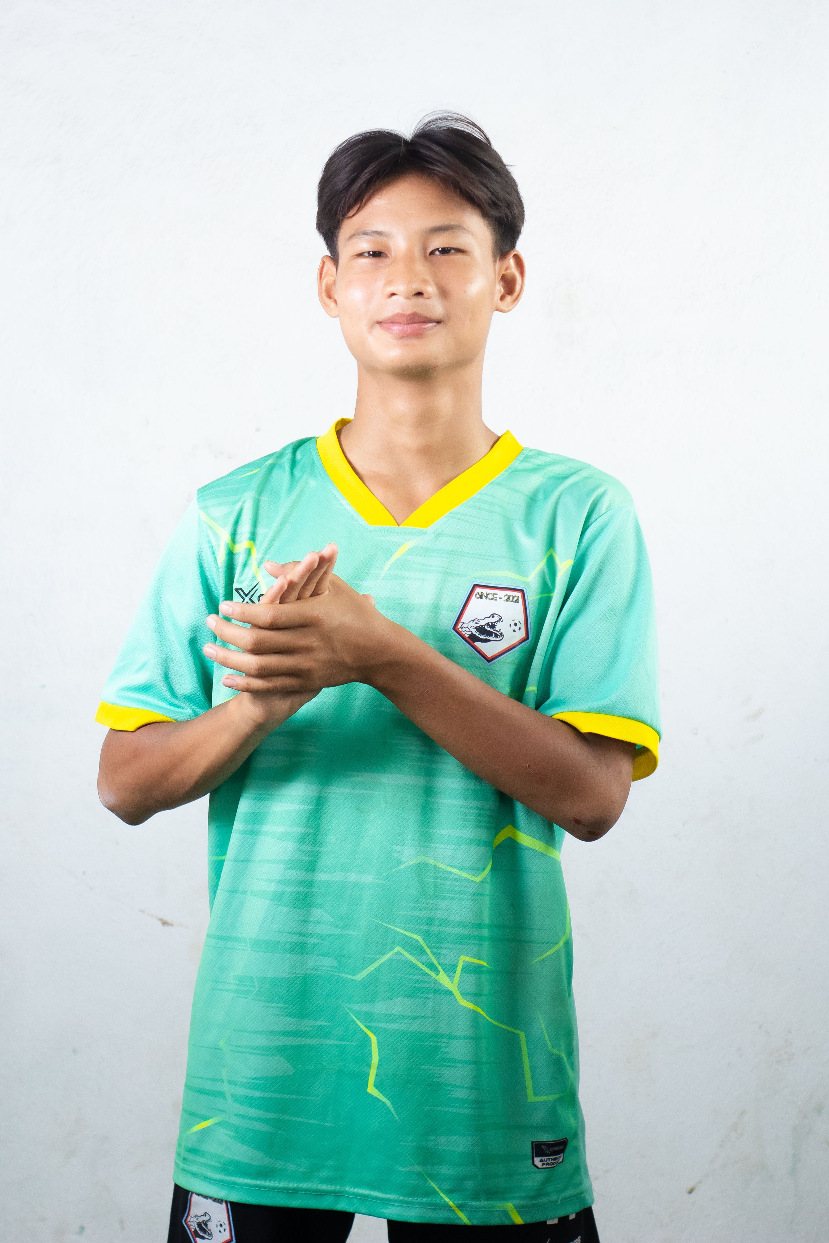 Young Athlete in Green Sports Jersey Portrait