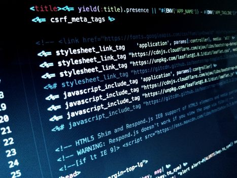 Detailed view of HTML and JavaScript code displayed on a computer monitor.