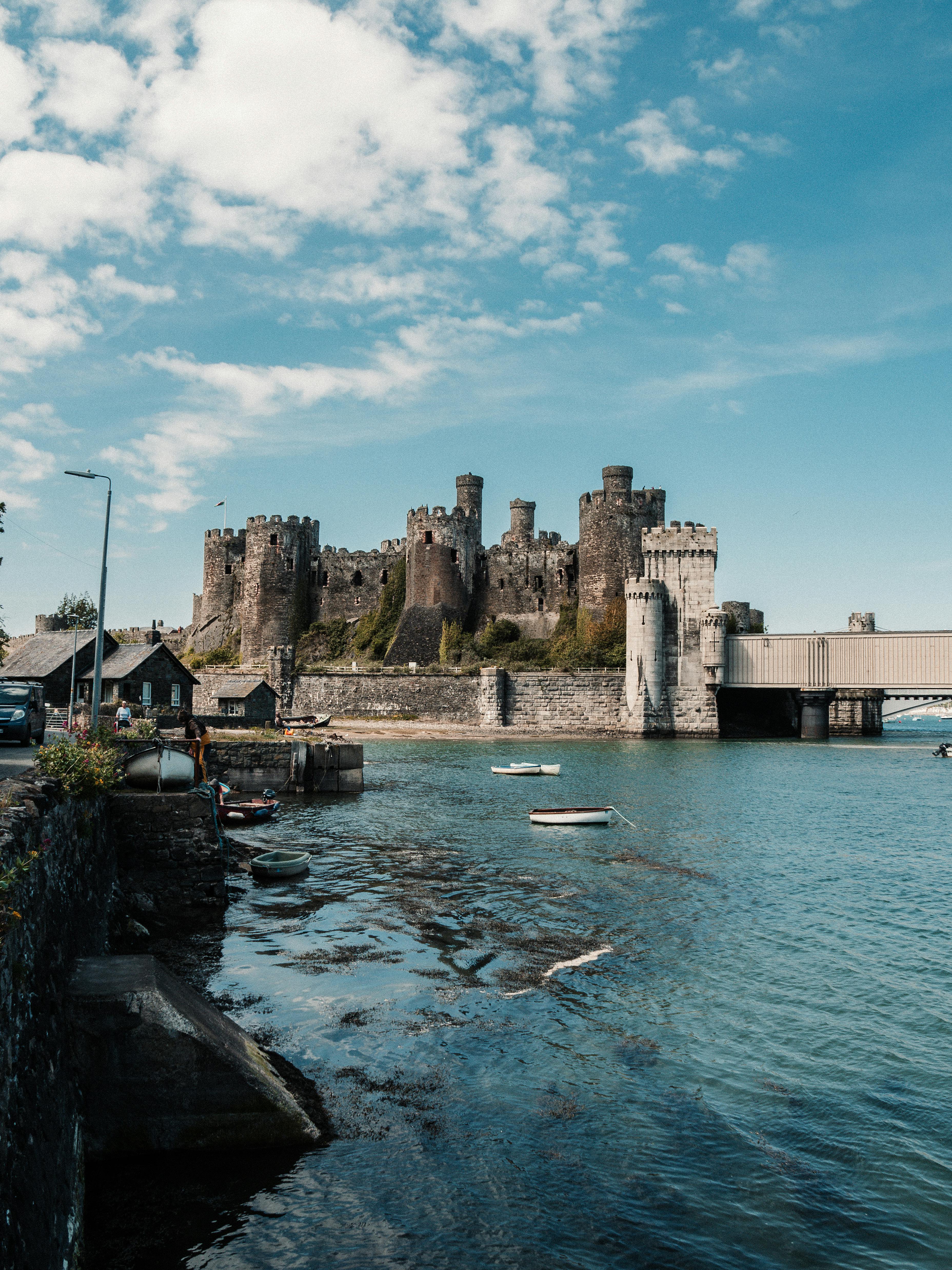 Stunning view of Conwy Castle by the River Conwy on a bright summer day.