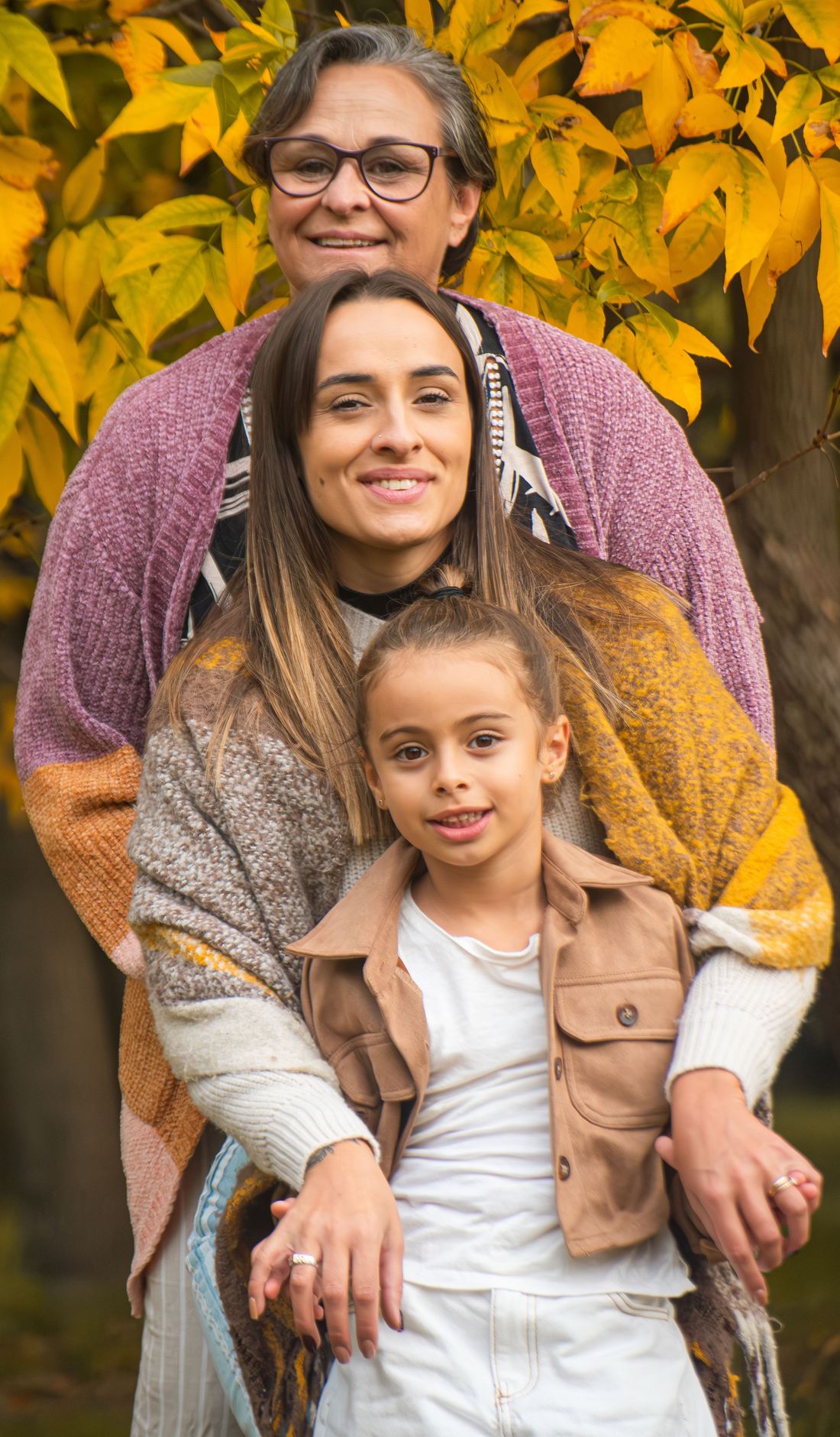 A happy, photo-realistic family sharing a tender moment