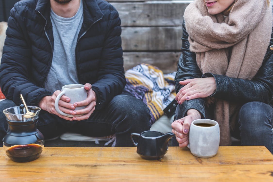 Two Person in Front of Coffee Table