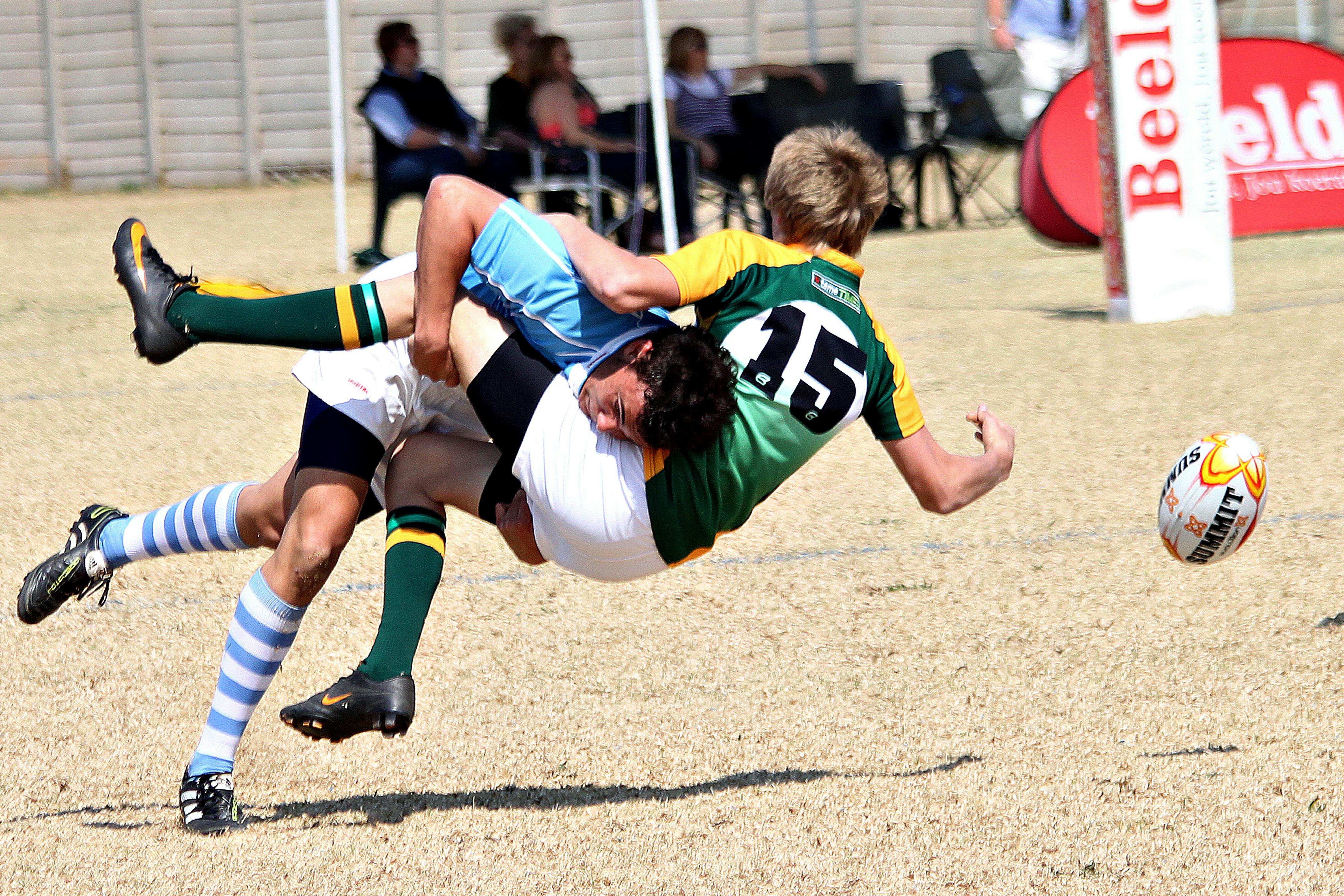 players colliding during rugby game