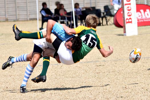 Players Colliding During Rugby Game