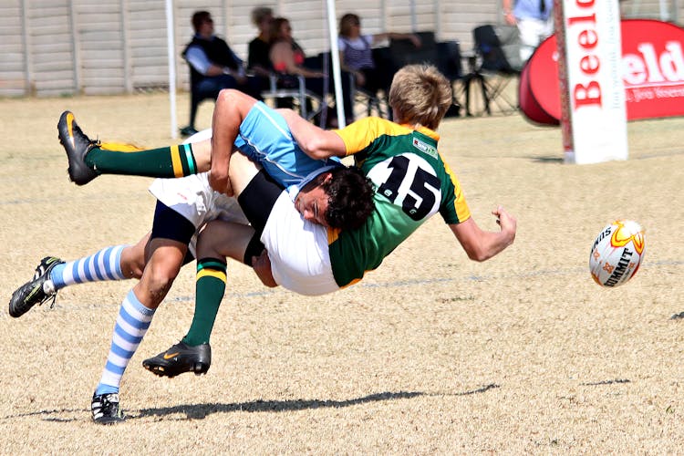 Players Colliding During Rugby Game