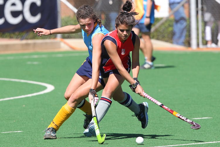 Women Playing Field Hockey