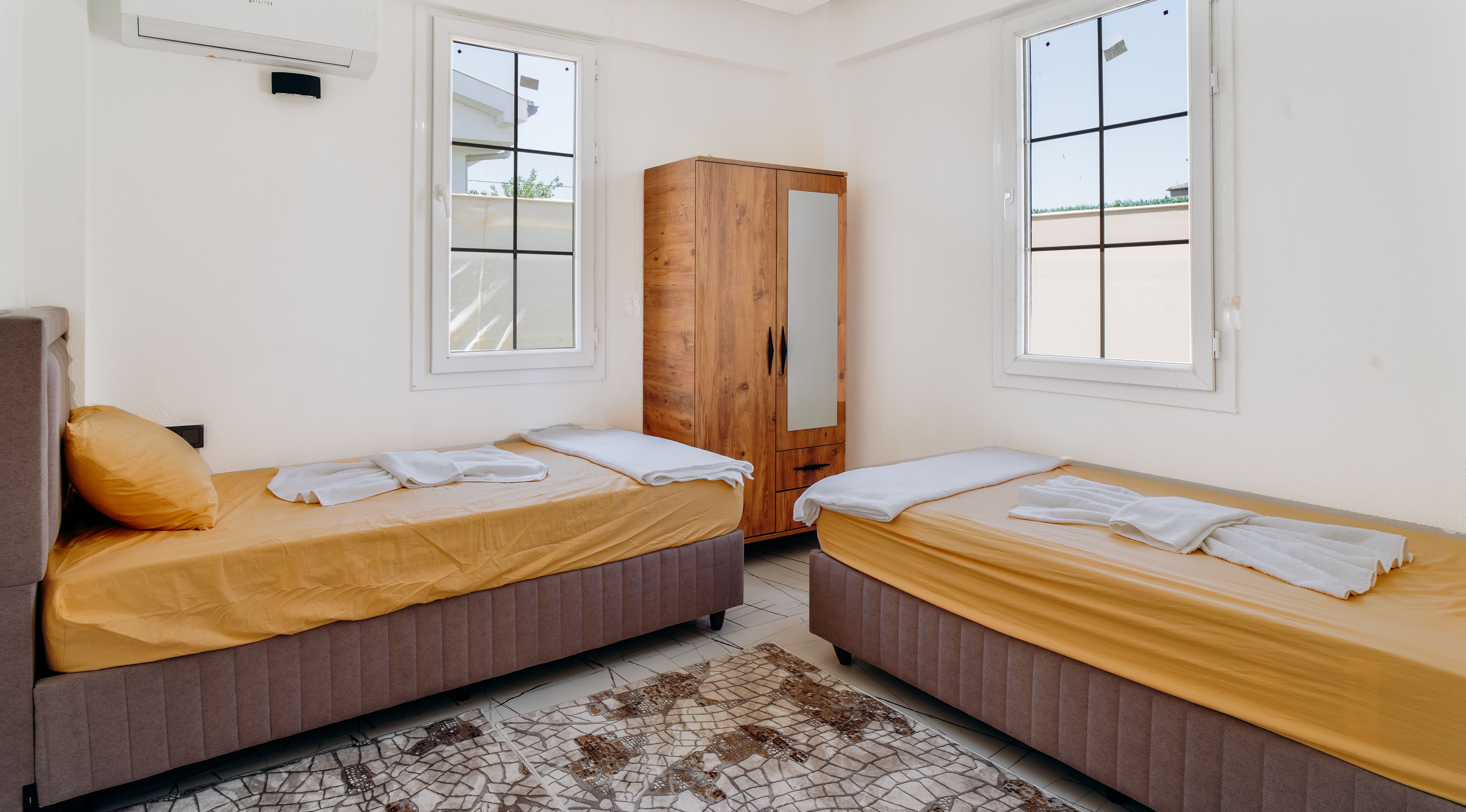 Cozy Modern Bedroom with Yellow Bedding · Free Stock Photo