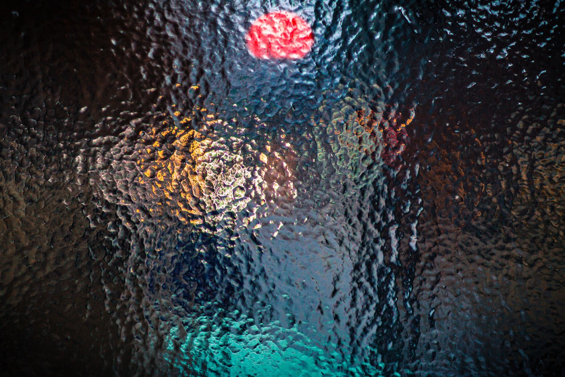 Vibrant abstract glass texture with defocused colorful light, illustrating glassmorphism and blur effects