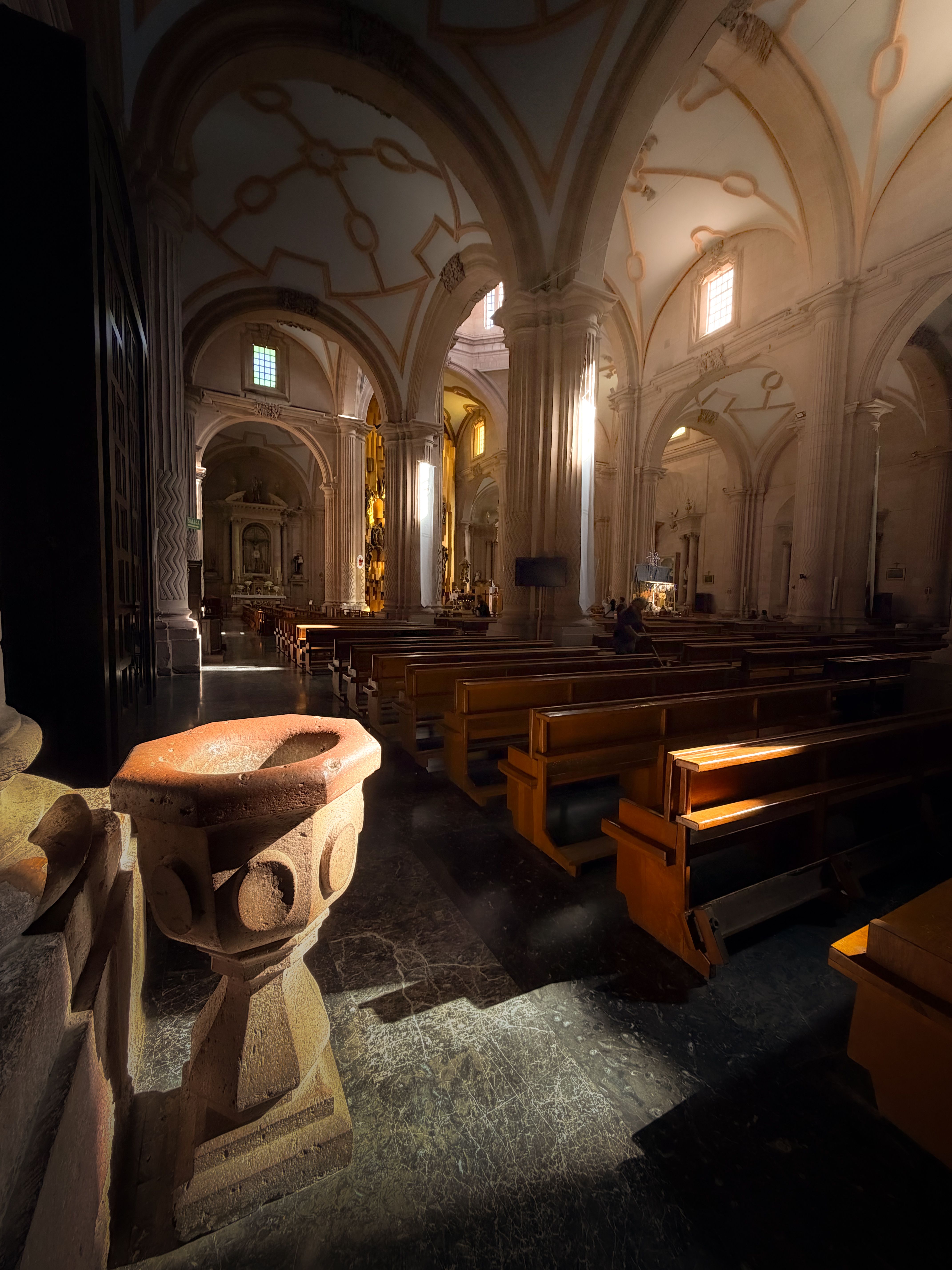 Sunlight streaming into the historic cathedral interior in Zacatecas, showcasing architectural beauty.