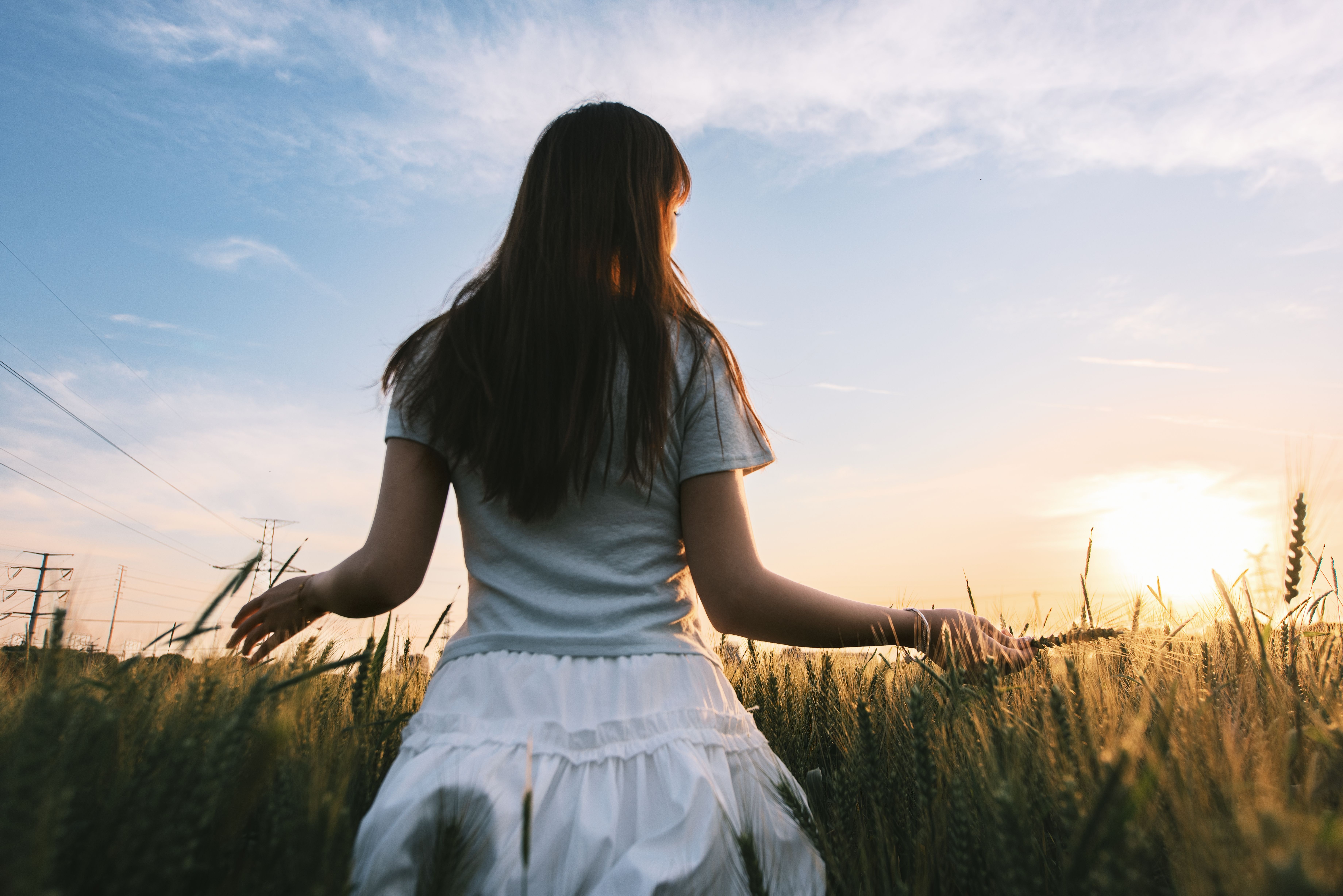 Woman in White Dress Standing on Wheat Field · Free Stock Photo