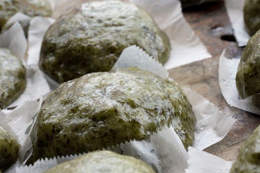 Authentic Taiwanese Qingtuan rice cake made with wormwood, captured up close in Taipei.