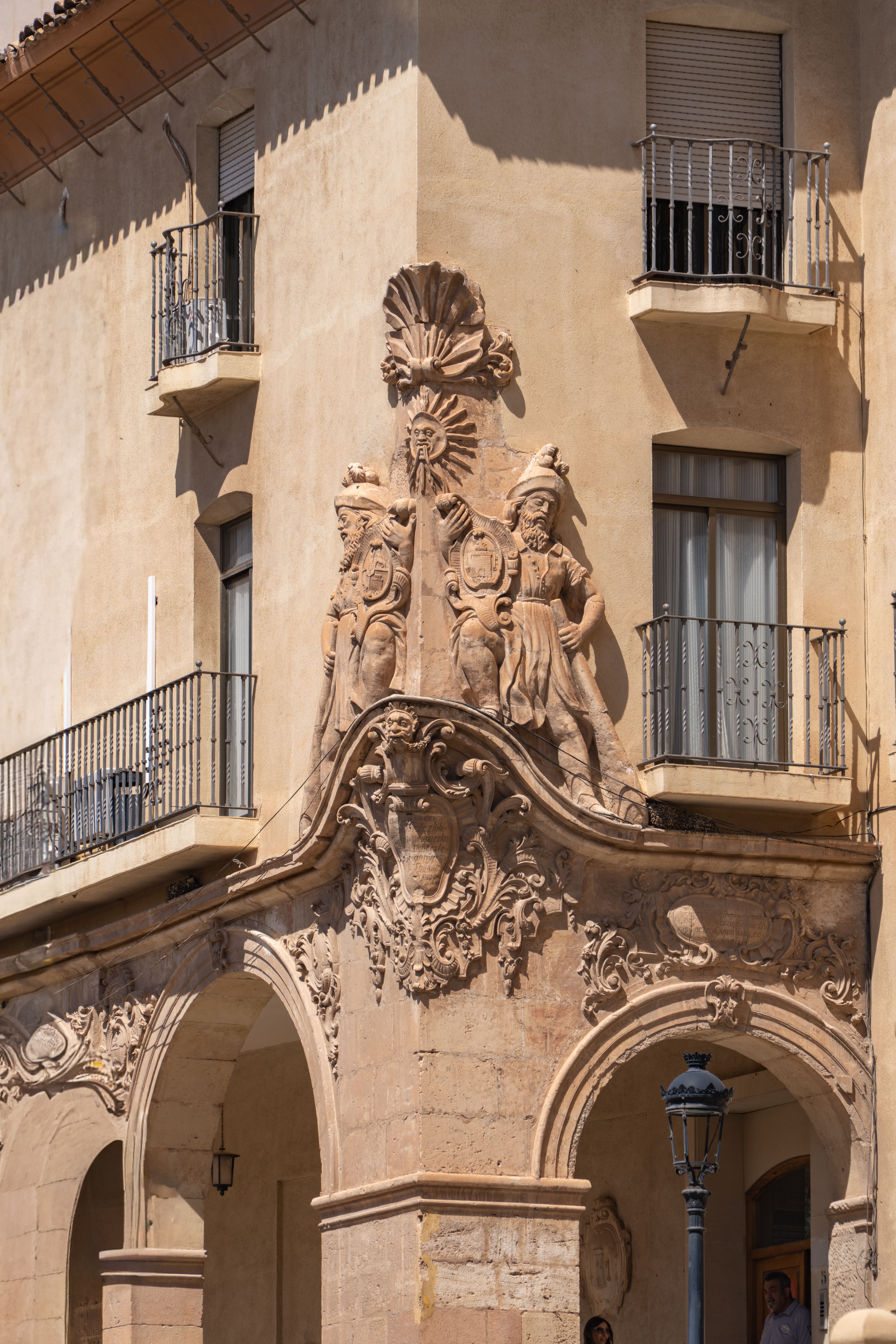 Detailed facade of historic building showcasing sculptures and arches in Lorca, Región de Murcia, Spain.