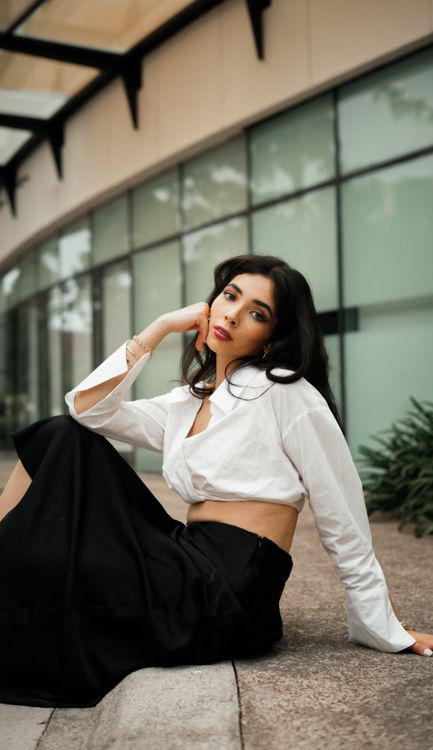 Stylish Woman Posing Outdoors in Urban Setting · Free Stock Photo