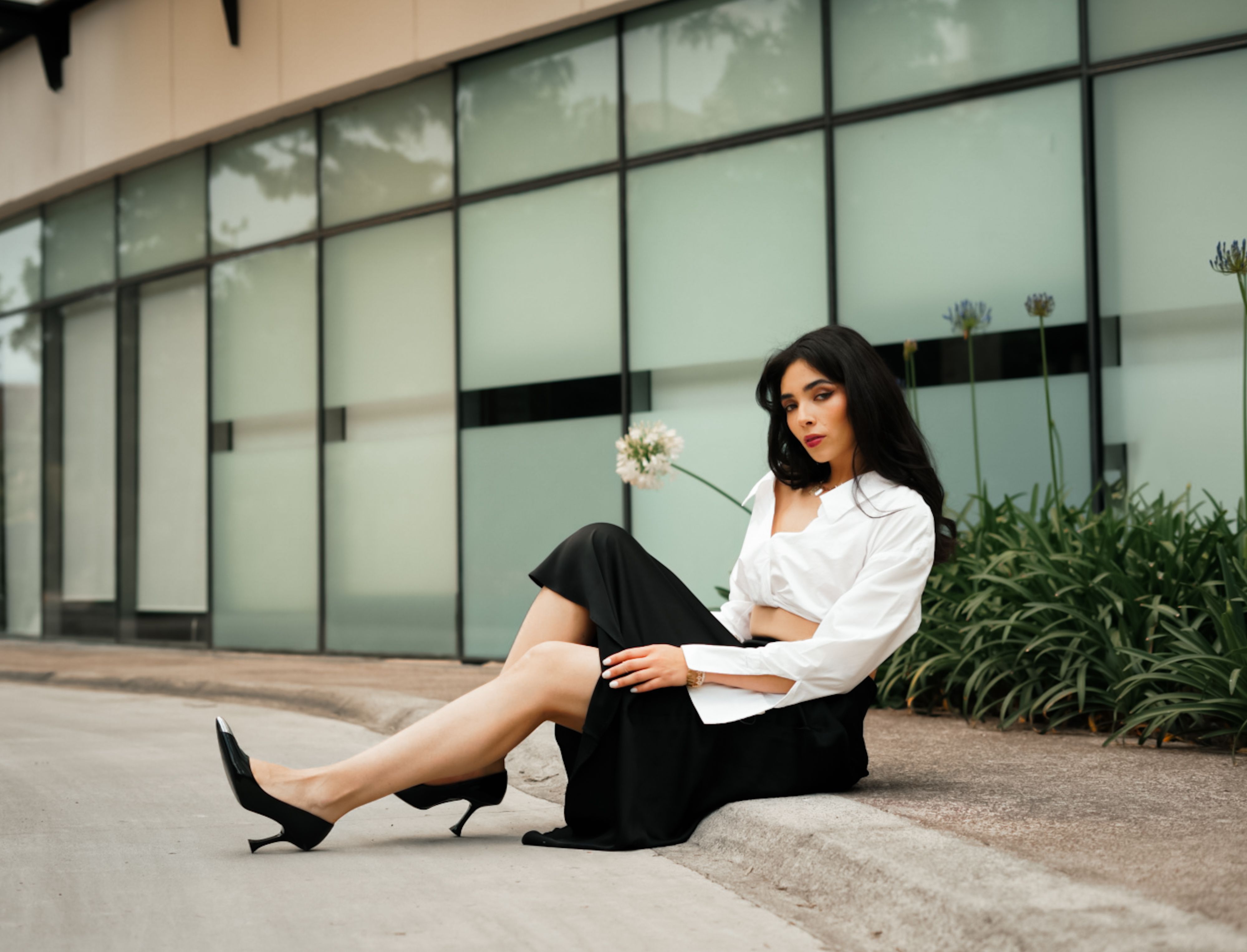 Two outfit arrangements using the same core pieces styled for two different dress code contexts, illustrating how context determines combination validity in the stress test