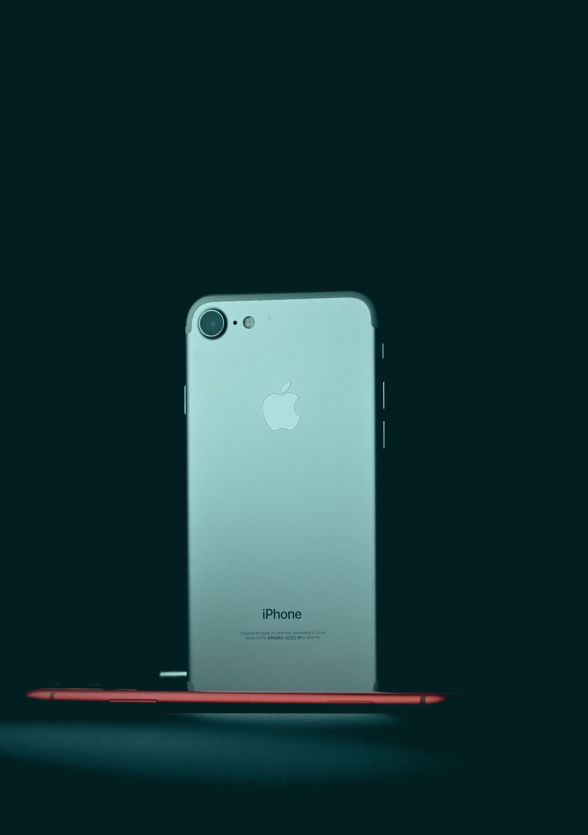 A modern smartphone photographed against a dark background