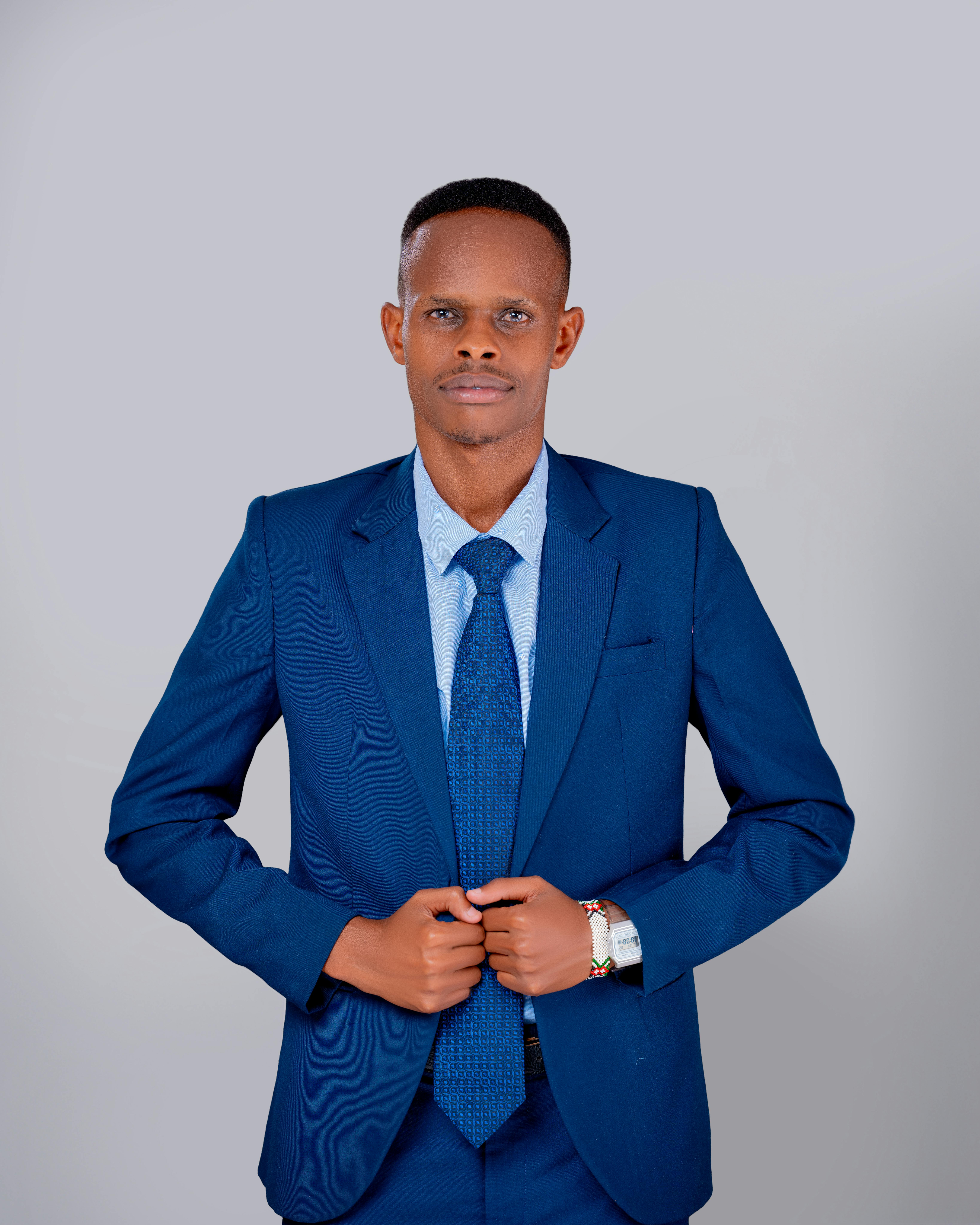 Portrait of a confident professional man in a blue suit against a neutral background.