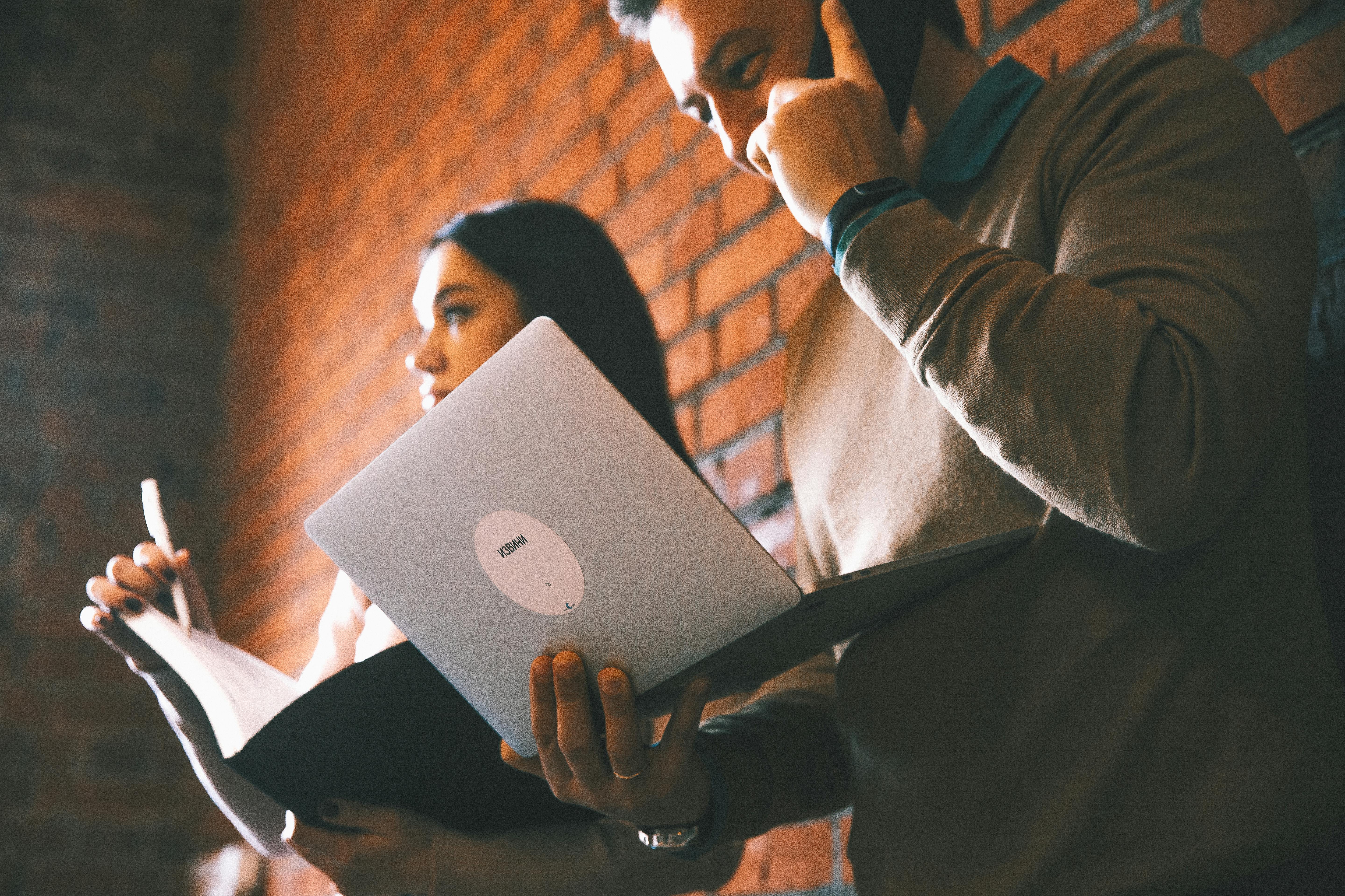 Person using a laptop outdoors emphasizing battery life and mobility