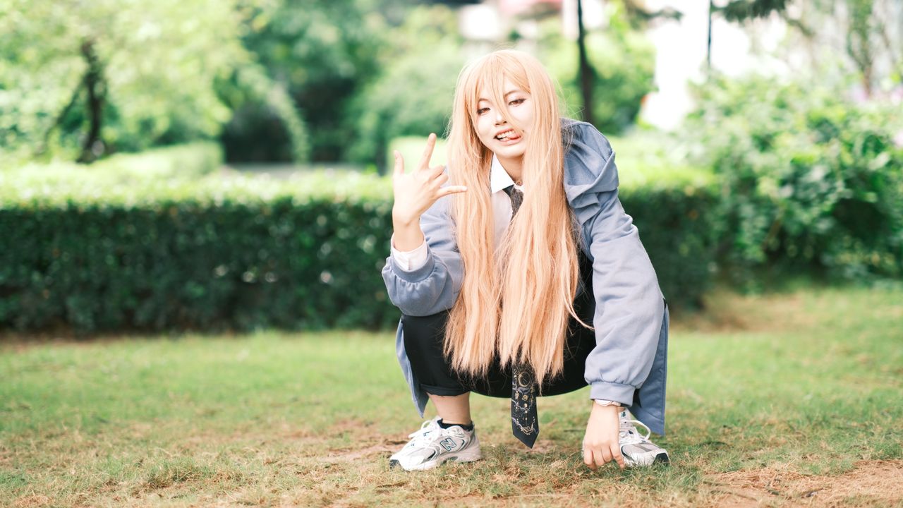 stylish young adult posing outdoors in casual attire showcasing unique