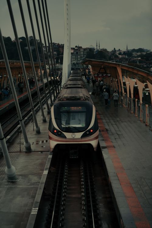 Free A modern train arriving at a bustling station in Istanbul, Turkey, capturing the urban commute. Stock Photo