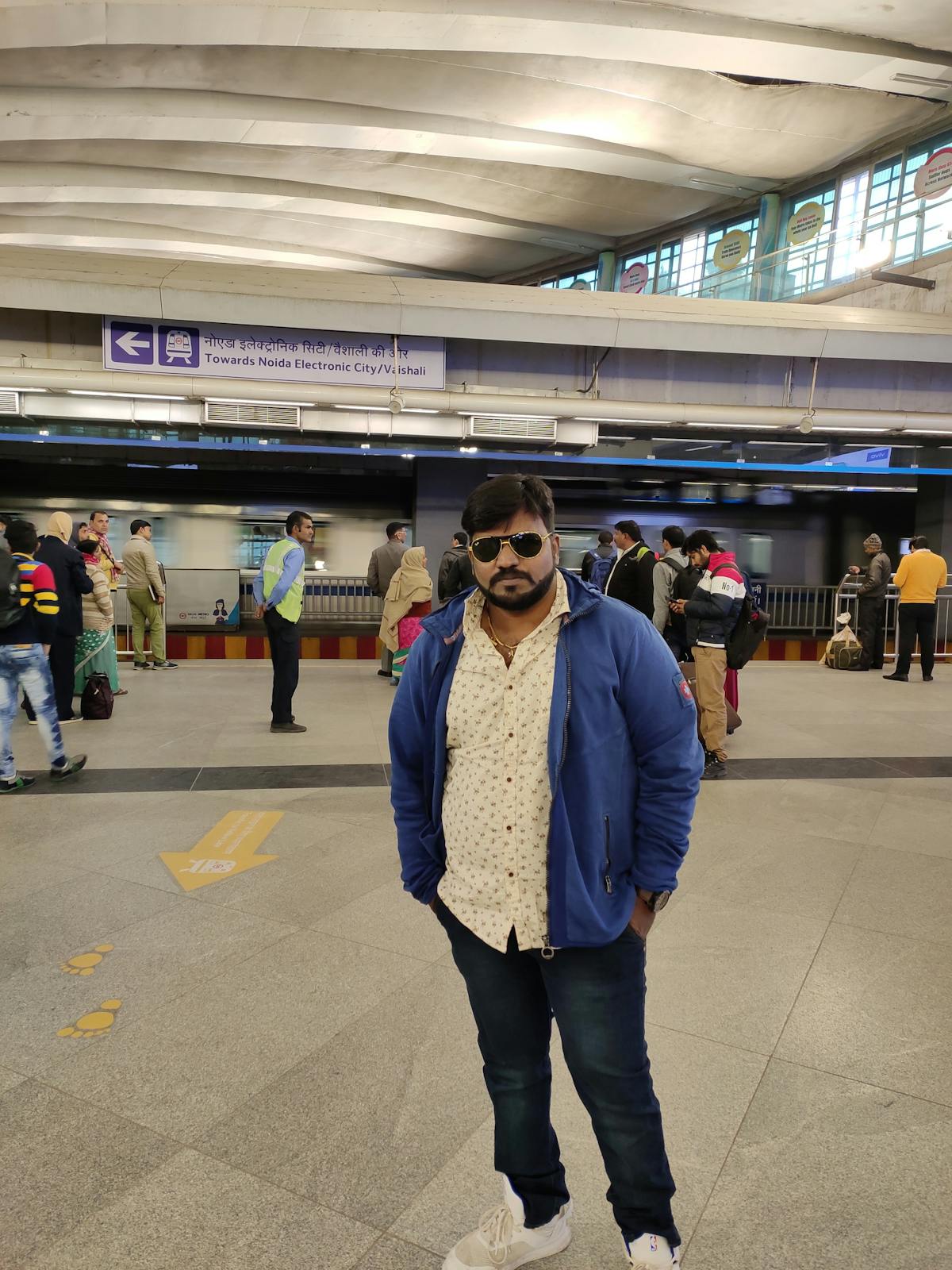 Person studying with headphones at a laptop and notebook, listening to lo-fi music