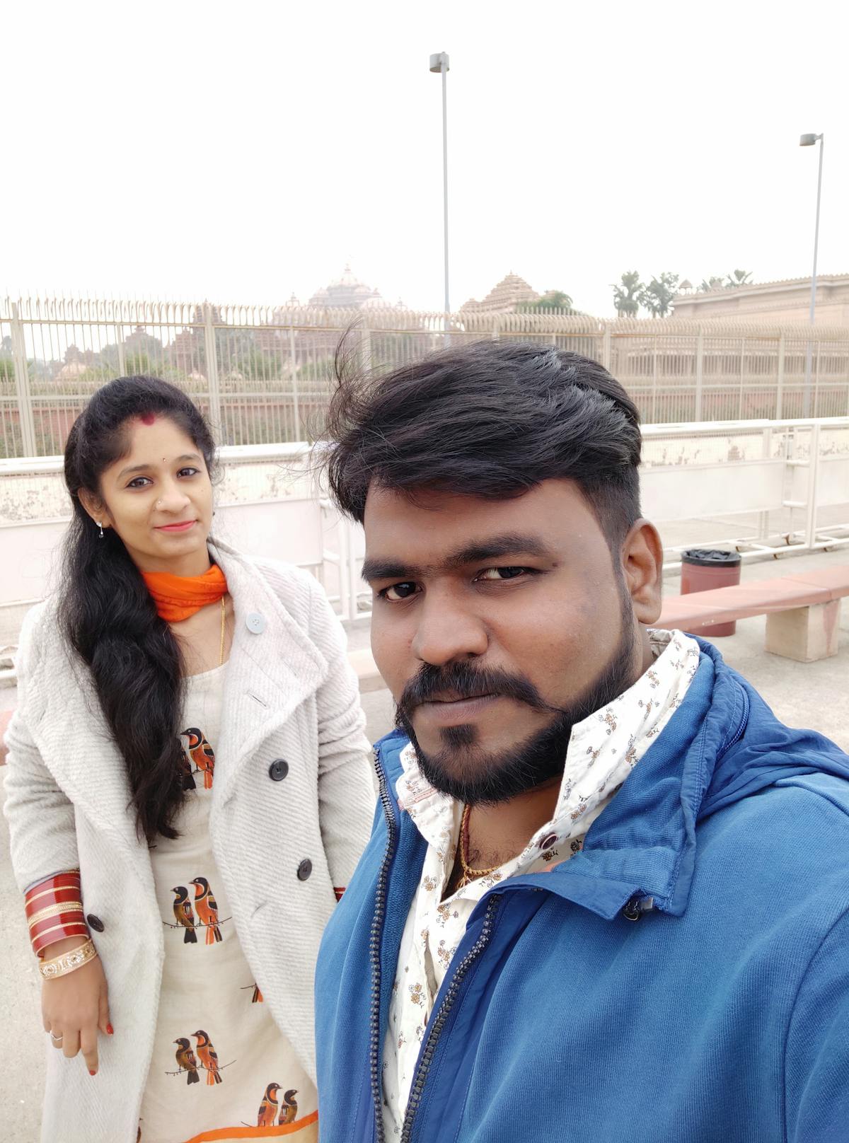 Person relaxing on a sofa listening to music with headphones