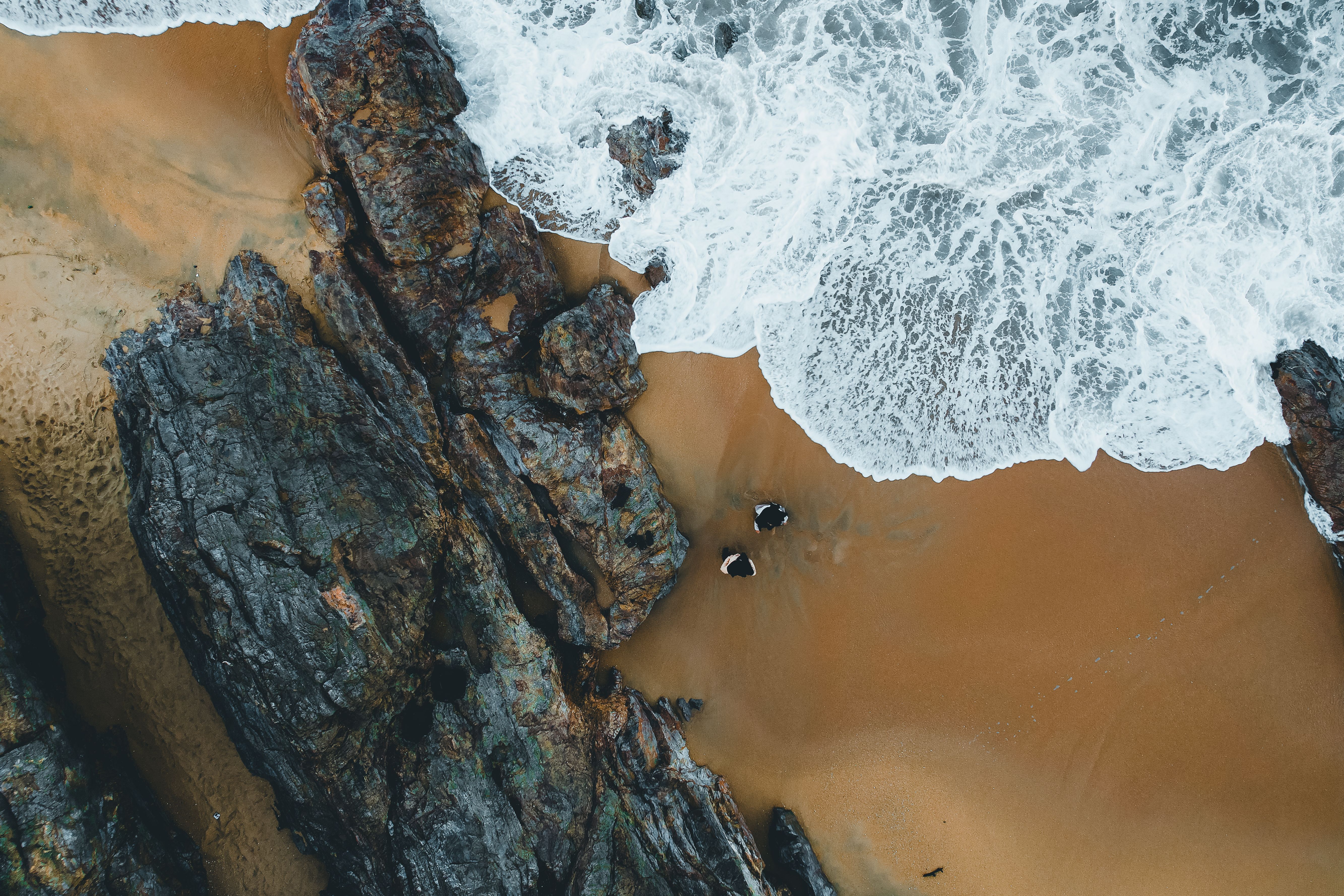 Aerial View of Rocky Beach with Crashing Waves · Free Stock Photo