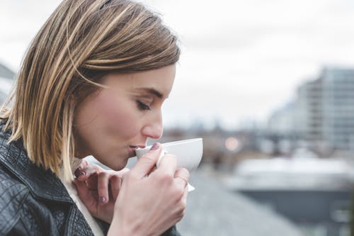 Woman Drinking on Teacup