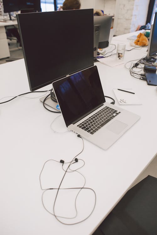 Macbook Pro on White Table