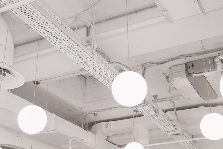 Commercial electrical and LED lighting in Orem Rows of modern light fixtures in a commercial office space