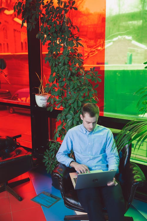 Free Man in Blue Dress Shirt Using Laptop Computer Stock Photo