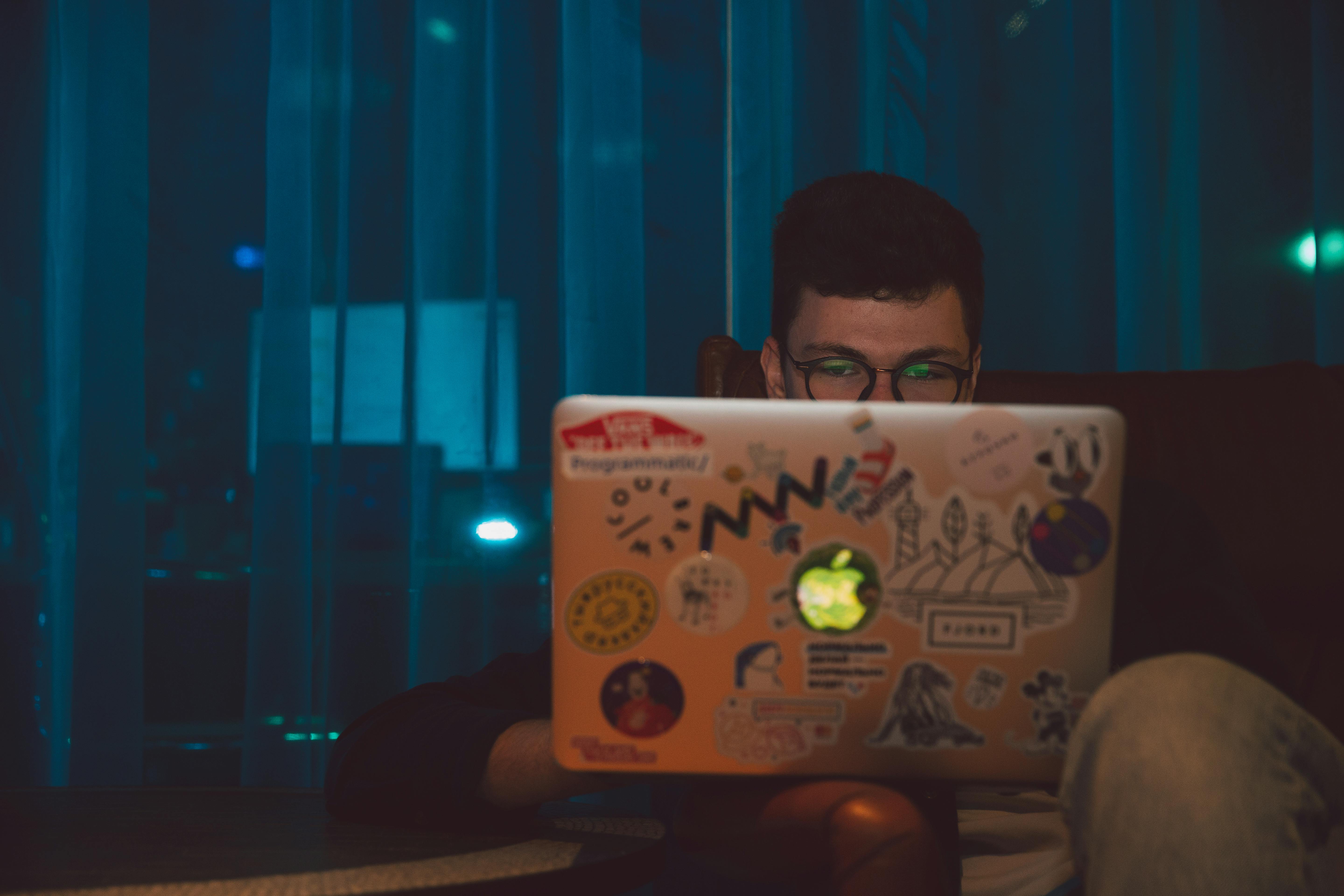 photo of man using laptop