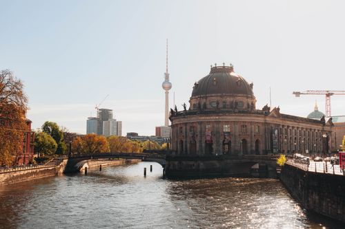 Free Sunny view of Bode Museum by the Spree River, showcasing Berlin's historic architecture and vibrant cityscape. Stock Photo