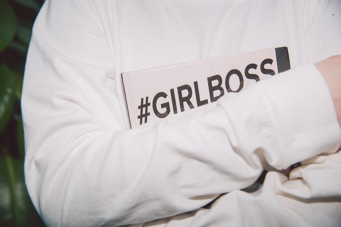 person Holding Book that says #GirlBoss