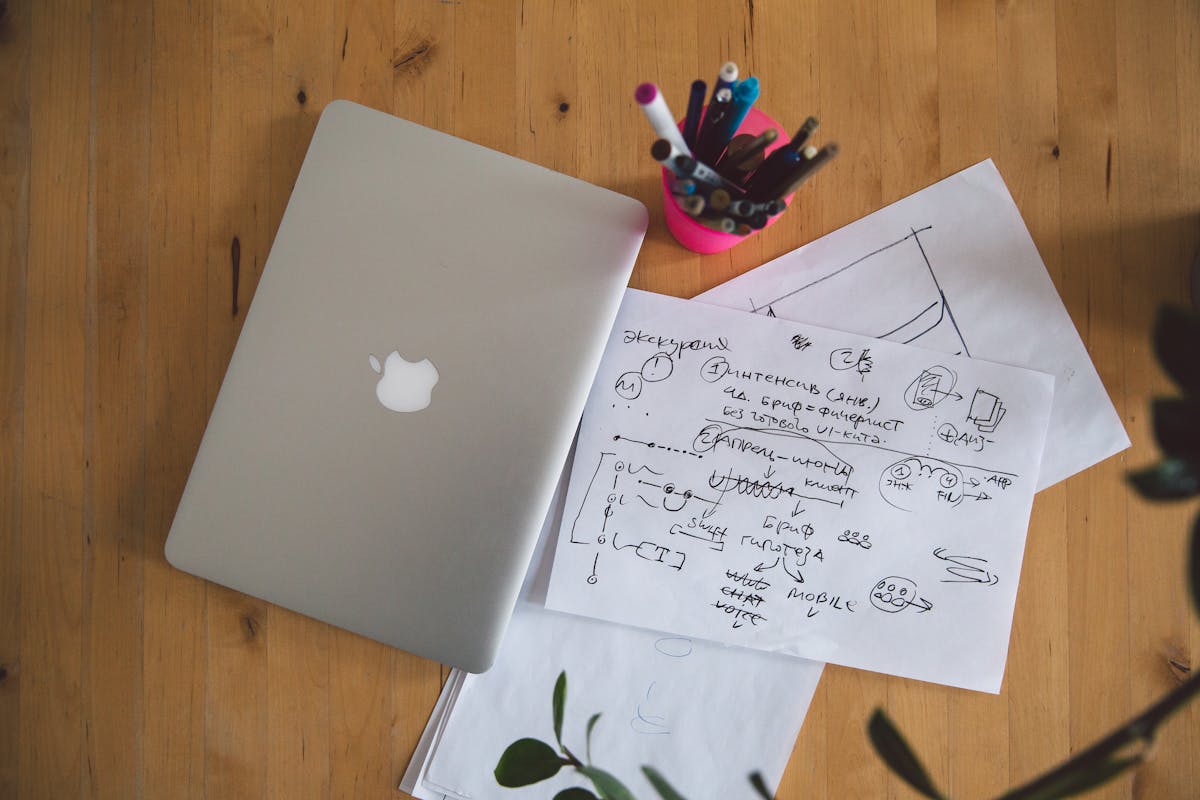 Person in a cozy chair reading a novel with a mug nearby
