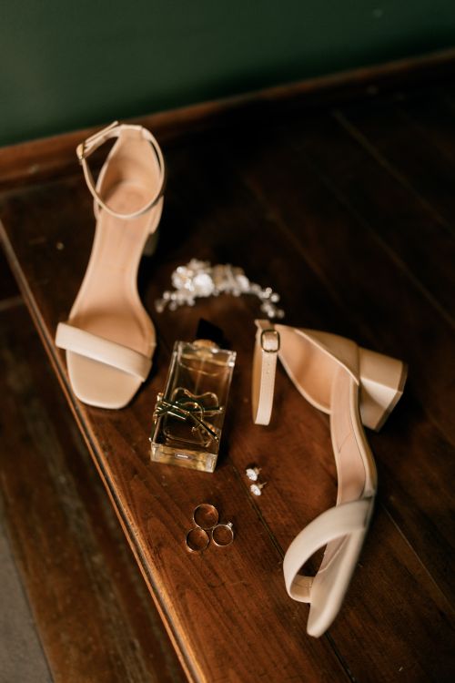 Free Beige high heels and wedding jewelry elegantly arranged on a wooden surface, perfect for bridal themes. Stock Photo