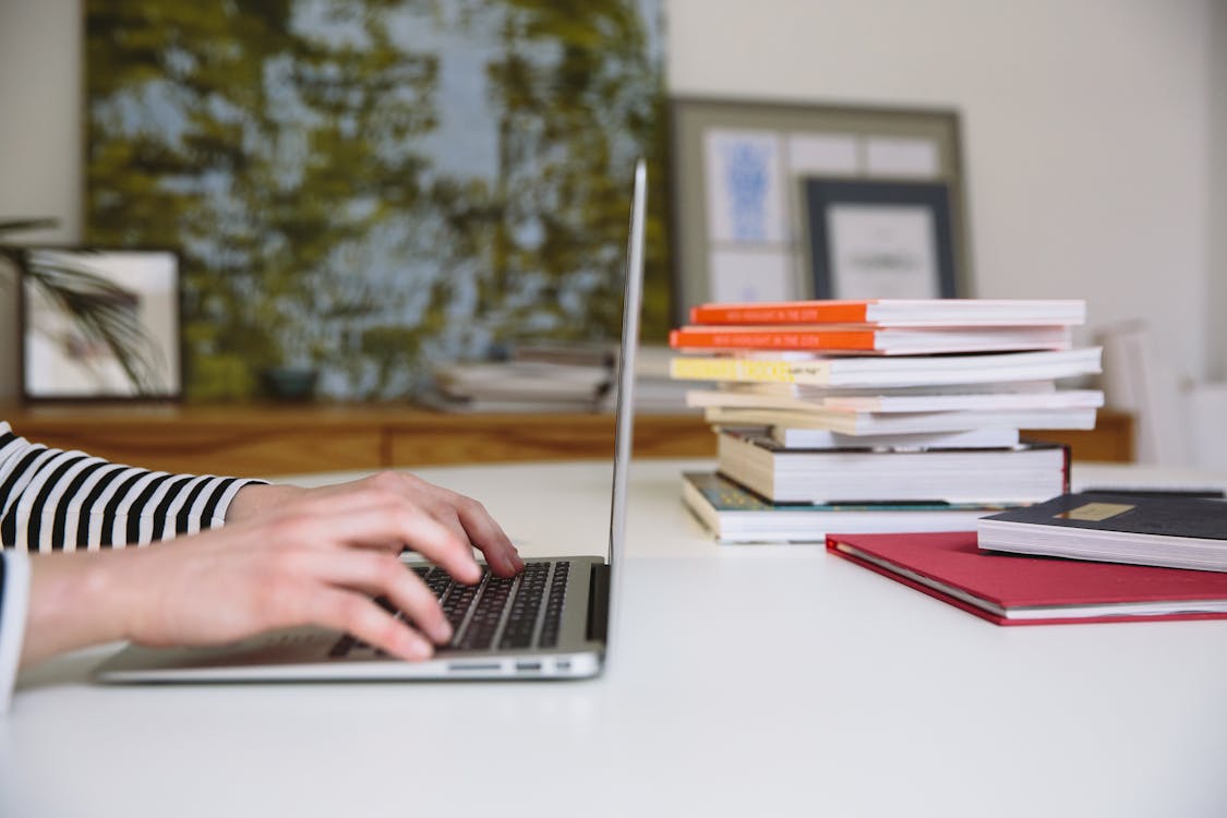 Photo Of Person Using Laptop 