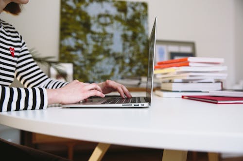 Photo Of Person Leaning On Table