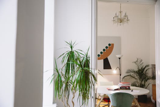 Stylish apartment interior featuring modern art and lush houseplants.